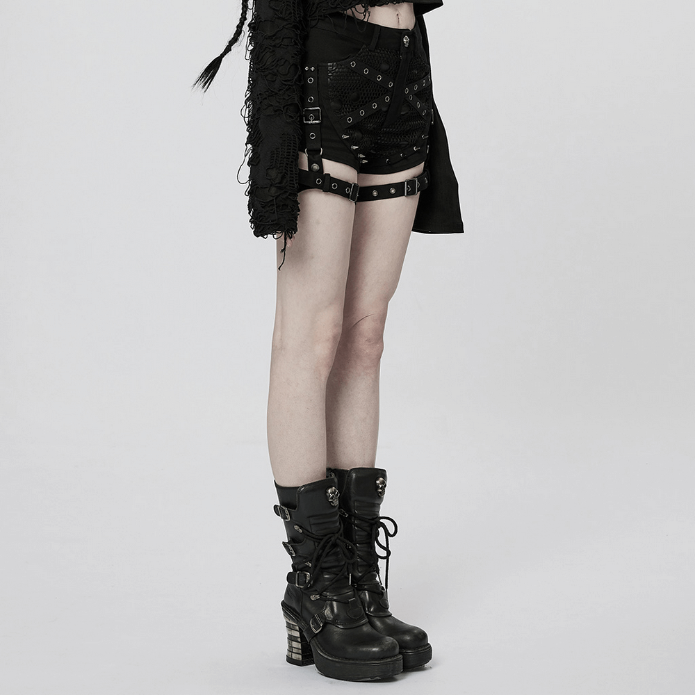 Punk black mesh garter shorts with buckle straps and edgy combat boots, showcasing a bold alternative fashion style.