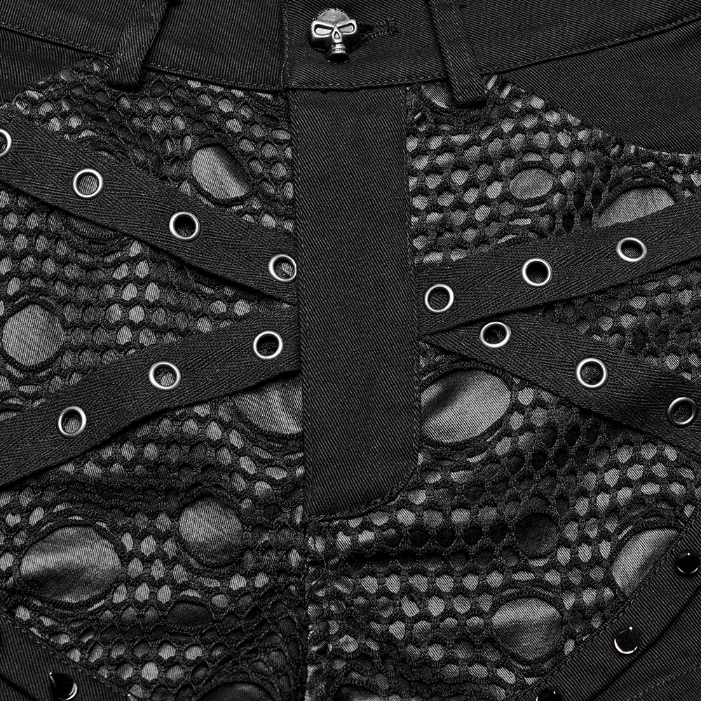 Close-up of punk black mesh garter shorts with buckle straps and decayed mesh texture.