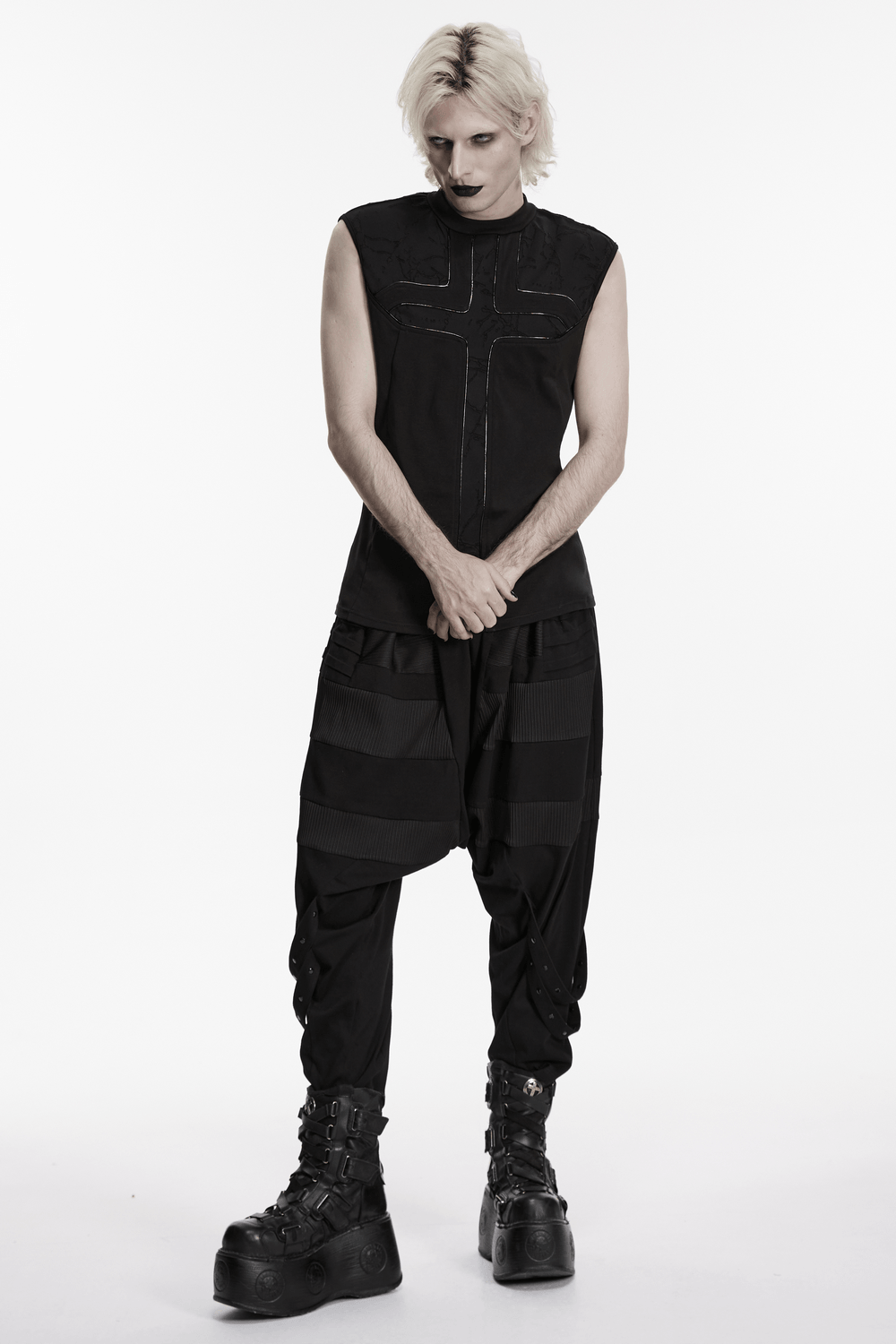 Punk Black Minimalist Cross Sleeveless Gothic Top paired with black baggy pants and chunky boots, showcasing gothic fashion.