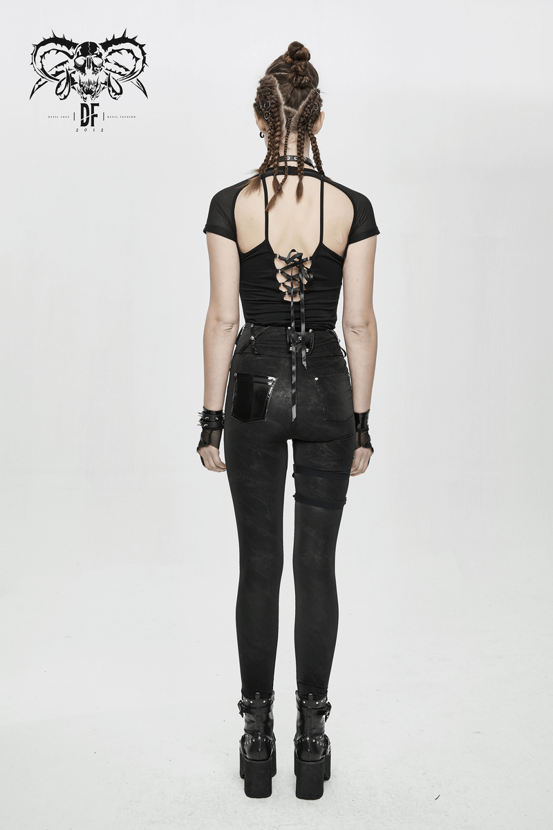 Womens punk black pants with pentagram harness belting and vinyl pockets, styled with braided hair and edgy accessories.