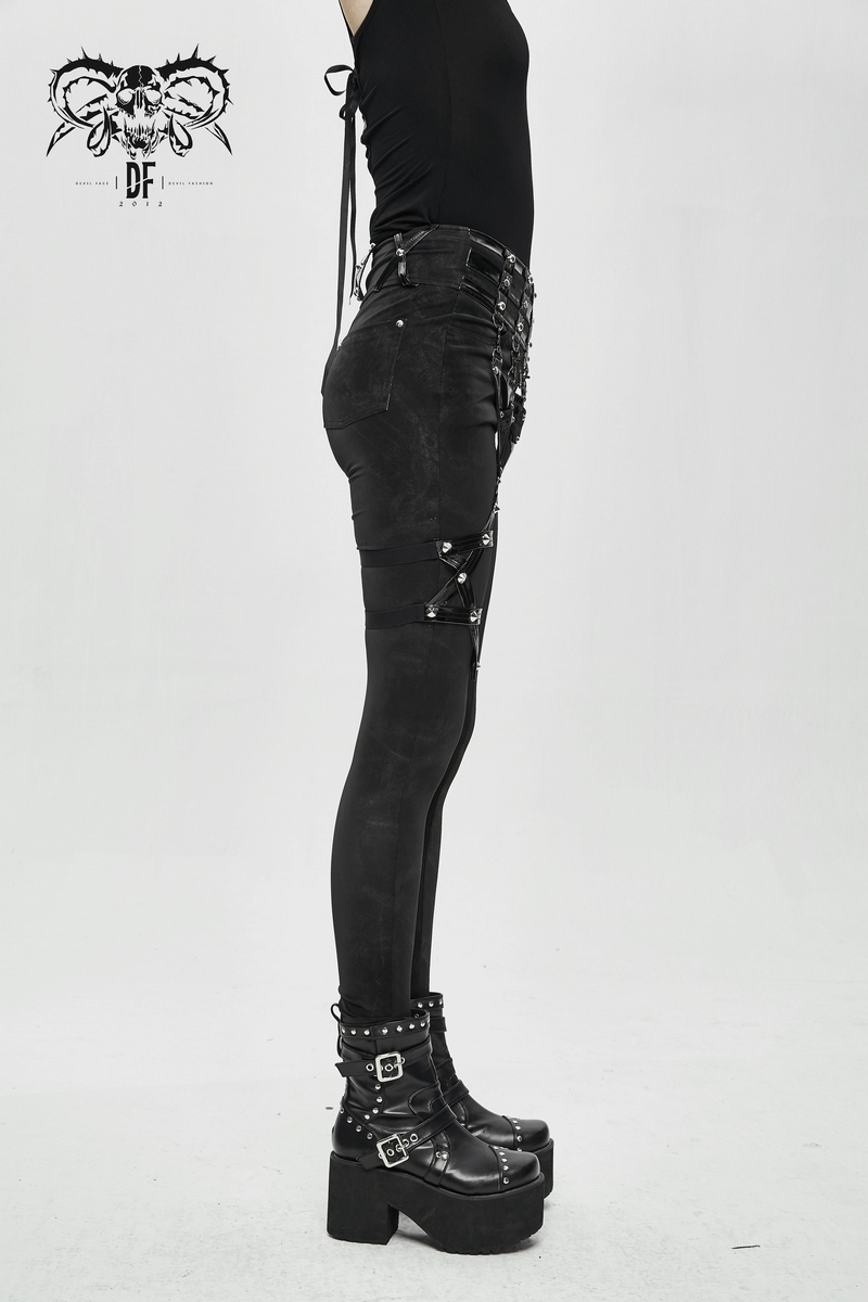 Side view of women's punk black pants with pentagram harness belts and zipper trousers, showcasing edgy style.