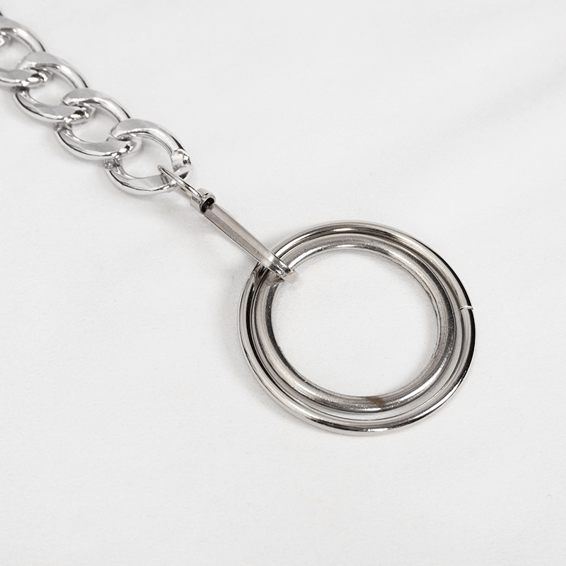 Close-up of thick silver metal chain with large circular ring, perfect accessory for punk style cargo pants.