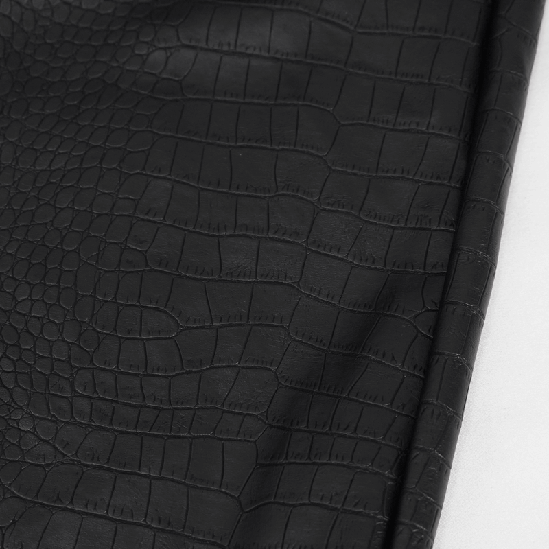 Close-up of black PU leather with a textured crocodile pattern, showcasing stylish women's punk cargo pants fabric.