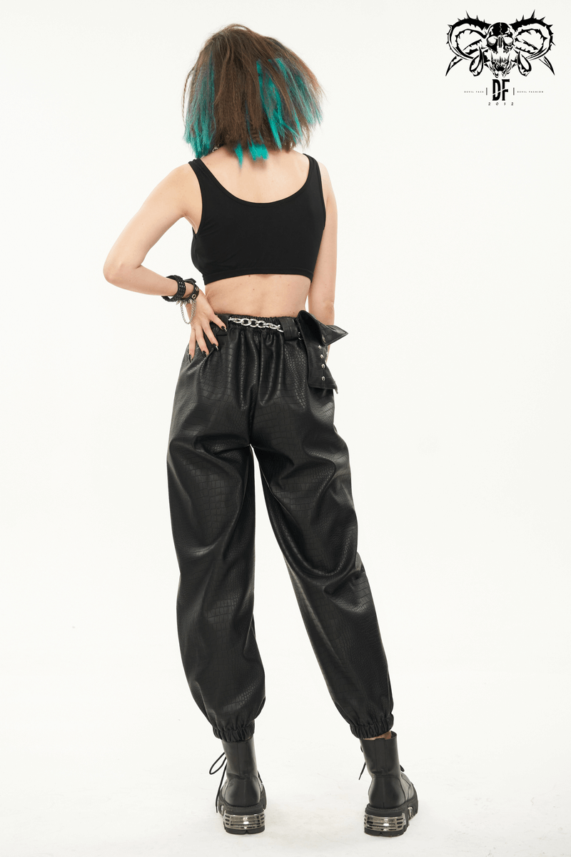 Back view of a woman in punk black PU leather cargo pants, showcasing a stylish metal chain and casual cut.
