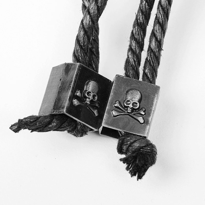 Black skull and crossbones metal trims on braided ropes for punk fashion accessories.