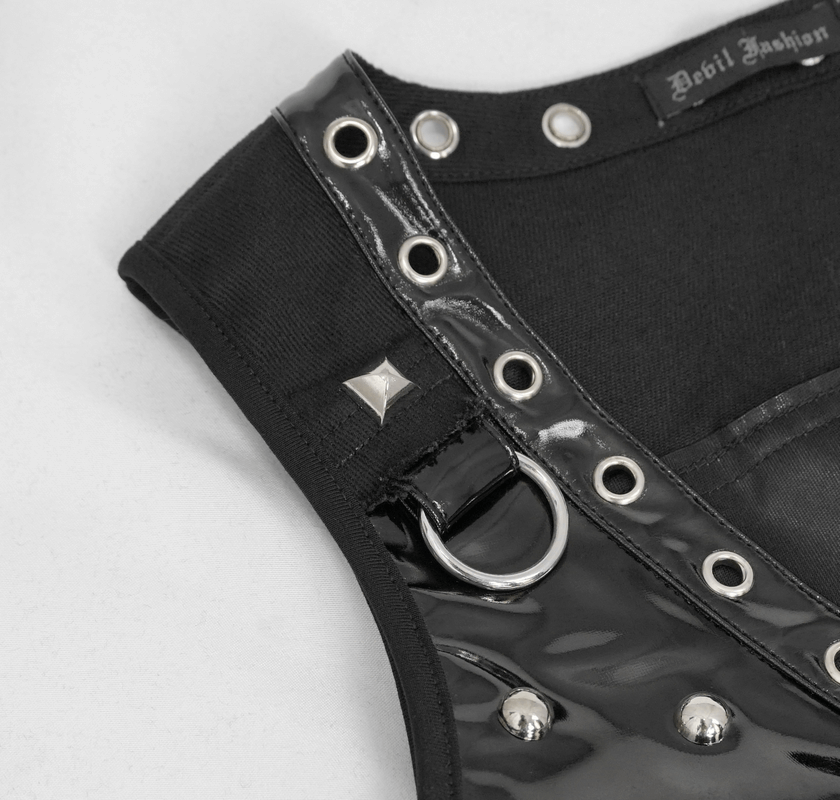 Close-up of a punk black short top with silver rivets and ring detail, perfect for a trendy women's wardrobe.