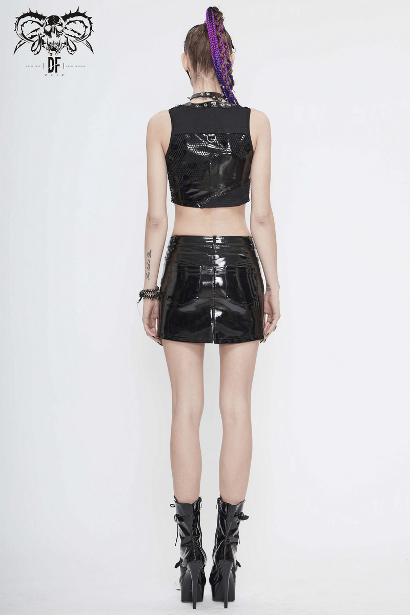 Back view of a model in a black cropped shiny top and black skirt, showcasing punk fashion style.