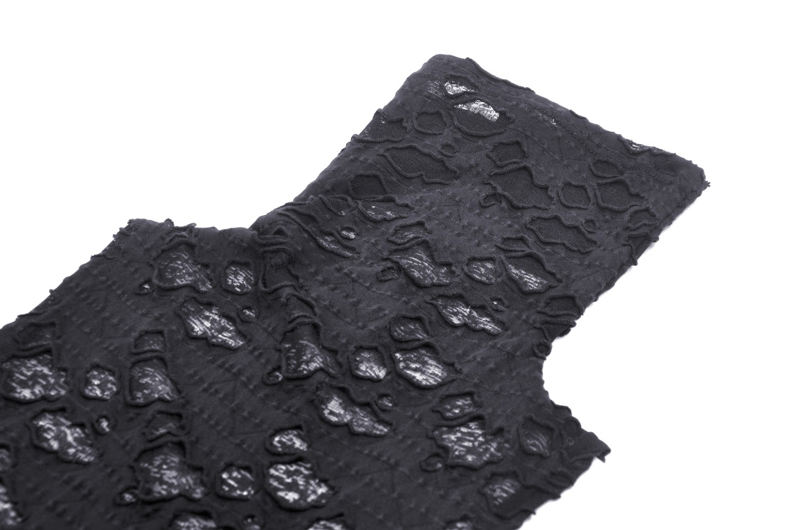 Close-up of a punk black sleeveless turtleneck top with edgy lace texture and intricate designs.