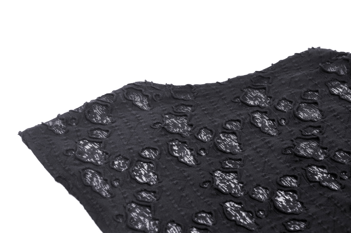 Close-up of edgy black lace fabric with textured pattern, perfect for a punk-style turtleneck top.