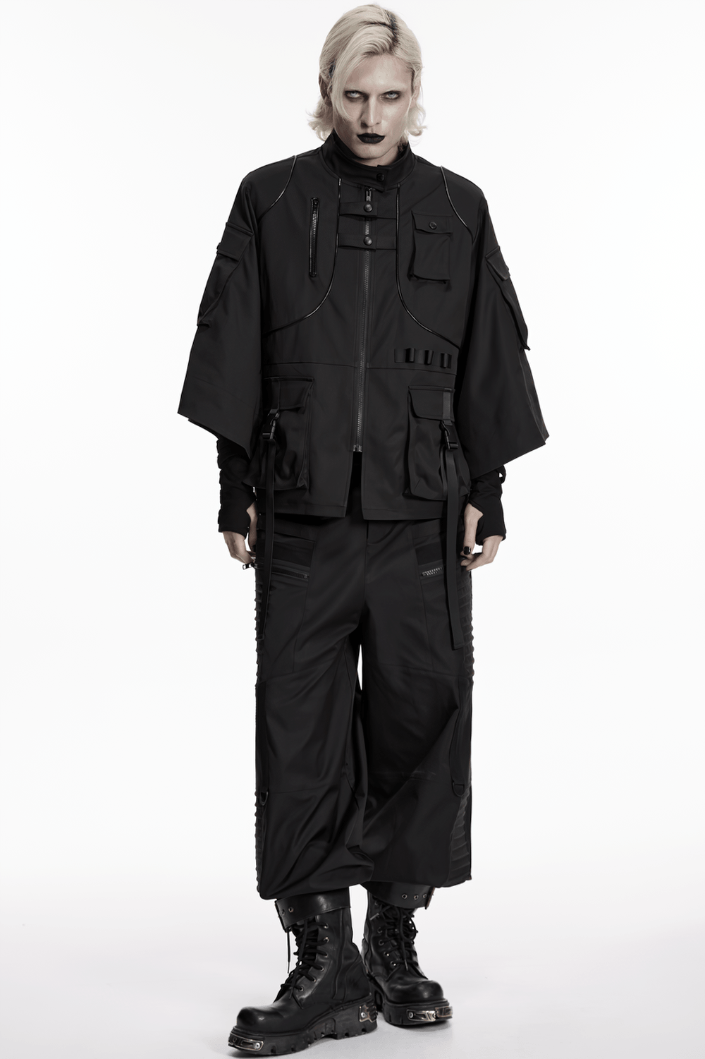 Punk Black Techwear Utility Jacket with Straps modeled by a person wearing dark fashion and combat boots.