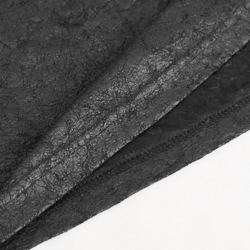 Close-up of textured black fabric showcasing unique patterns, ideal for punk fashion clothing.