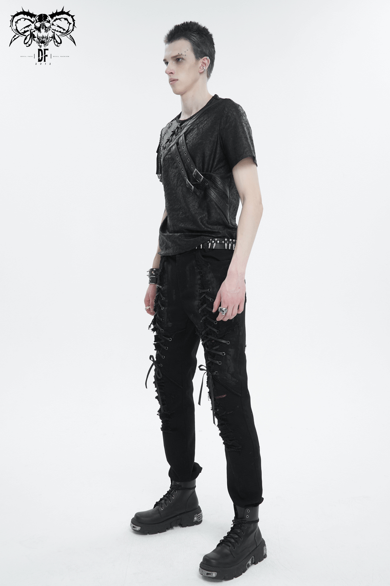 Stylish male model wearing a punk buckle splice t-shirt with pocket, showcasing alternative fashion.