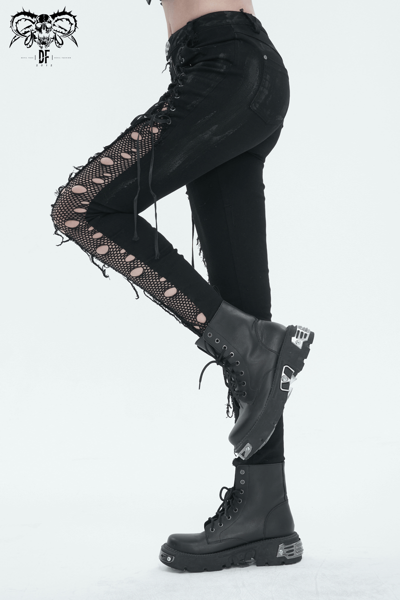 Punk black trousers with hole net side detailing and lace-up design, paired with edgy black combat boots.