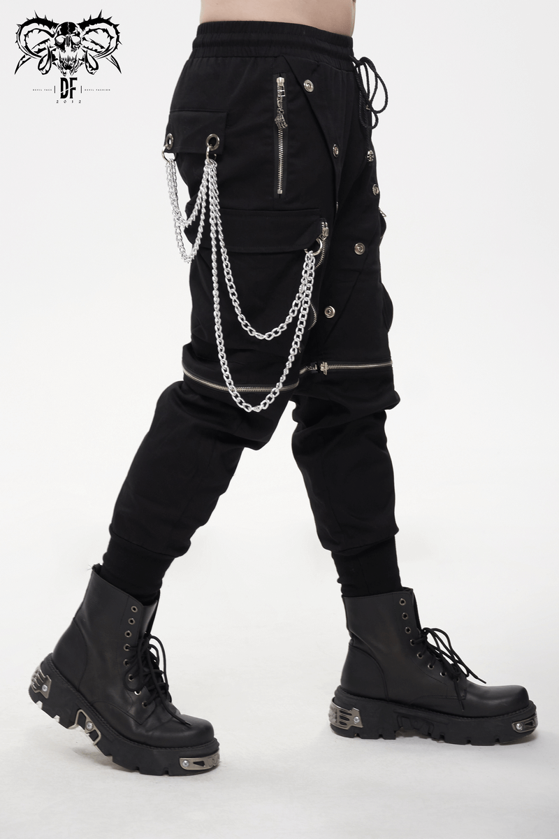 Men's punk cargo pants in black with metal buttons and detachable chains, styled with edgy boots.