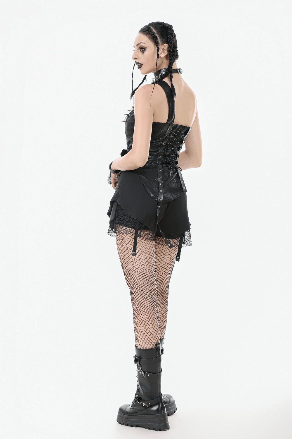 Punk corset top with spiked details and zipper closure, paired with fishnet stockings and stylish combat boots.