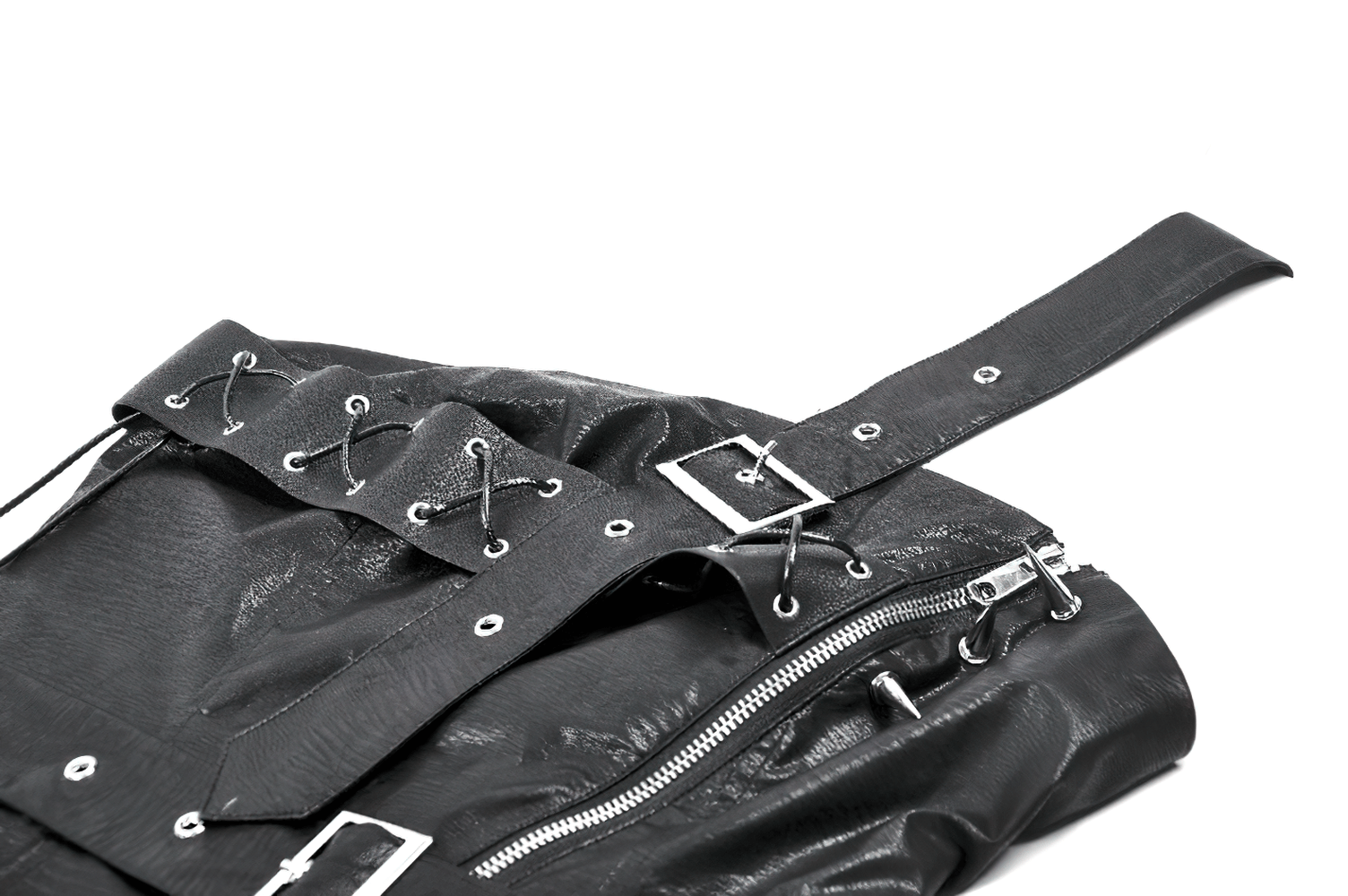 Close-up of a punk corset top with spiked details and zipper closure, showcasing edgy fashion elements.