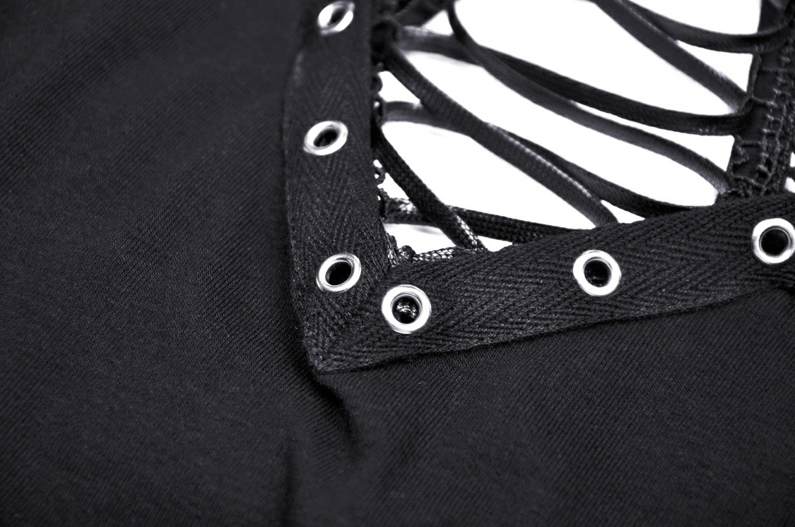 Close-up of lace-up front detail on black punk cutout T-shirt, featuring eyelets in dramatic mesh sleeves.