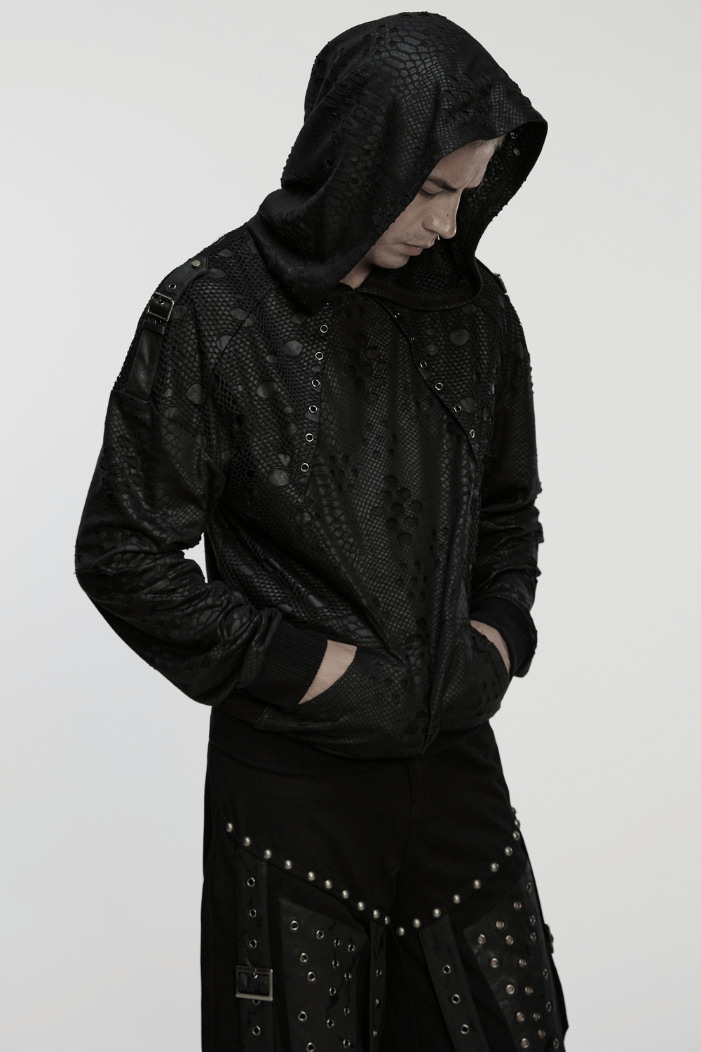 Punk Decadent Tattered Mesh Hoodie with Shoulder Buckles worn by model, featuring a loose fit and edgy design.