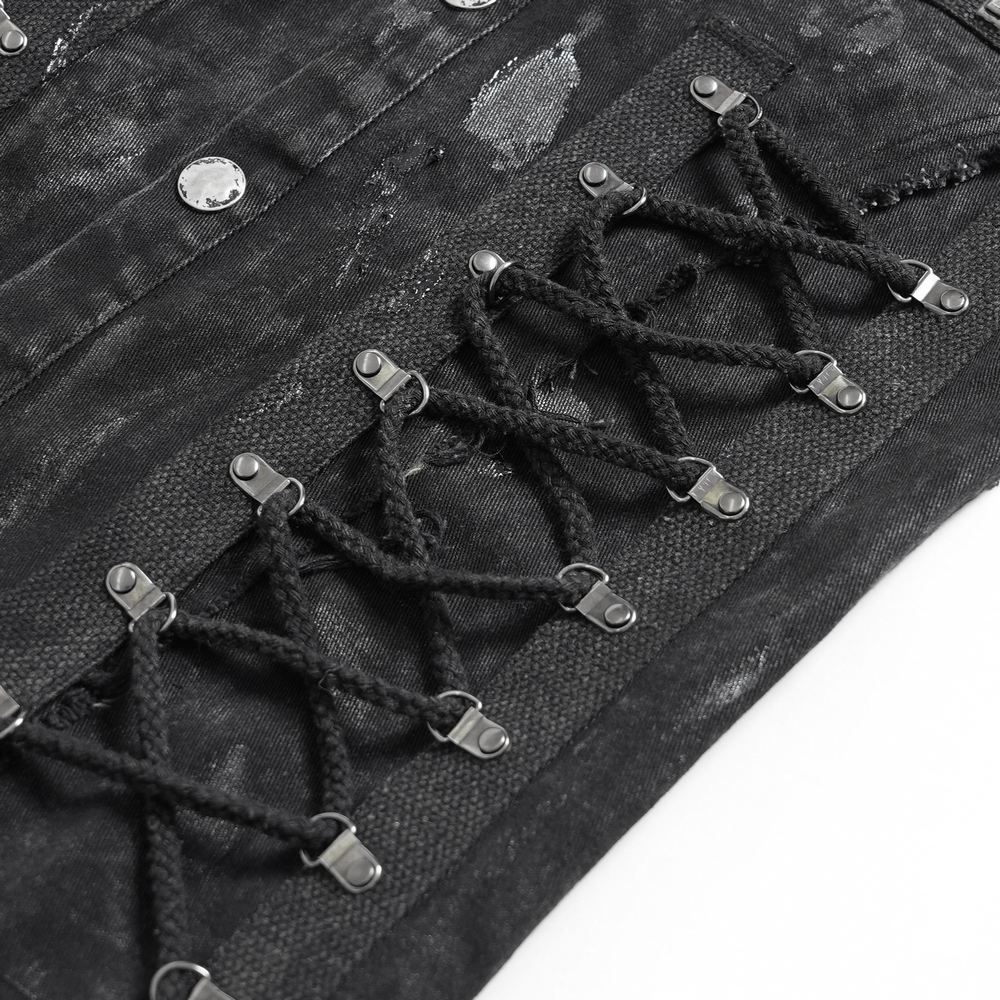 Close-up of punk denim shirt featuring lace-up sides and studded details for a bold style statement.