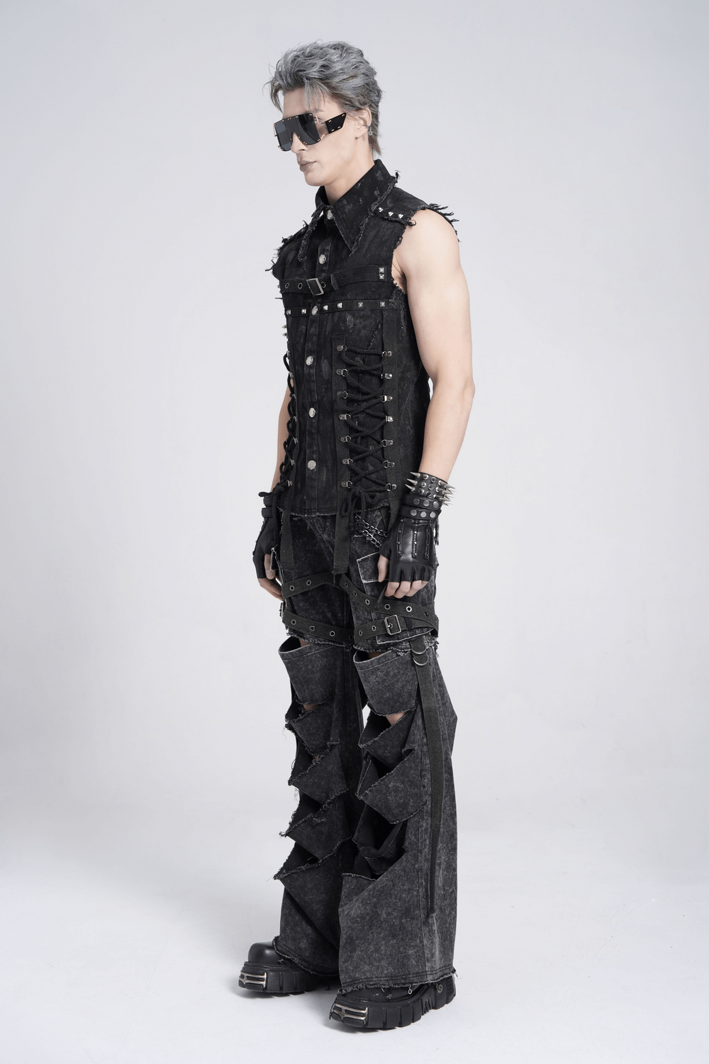 Punk denim shirt with lace-up sides and studded detail, showcasing edgy fashion style on a model.