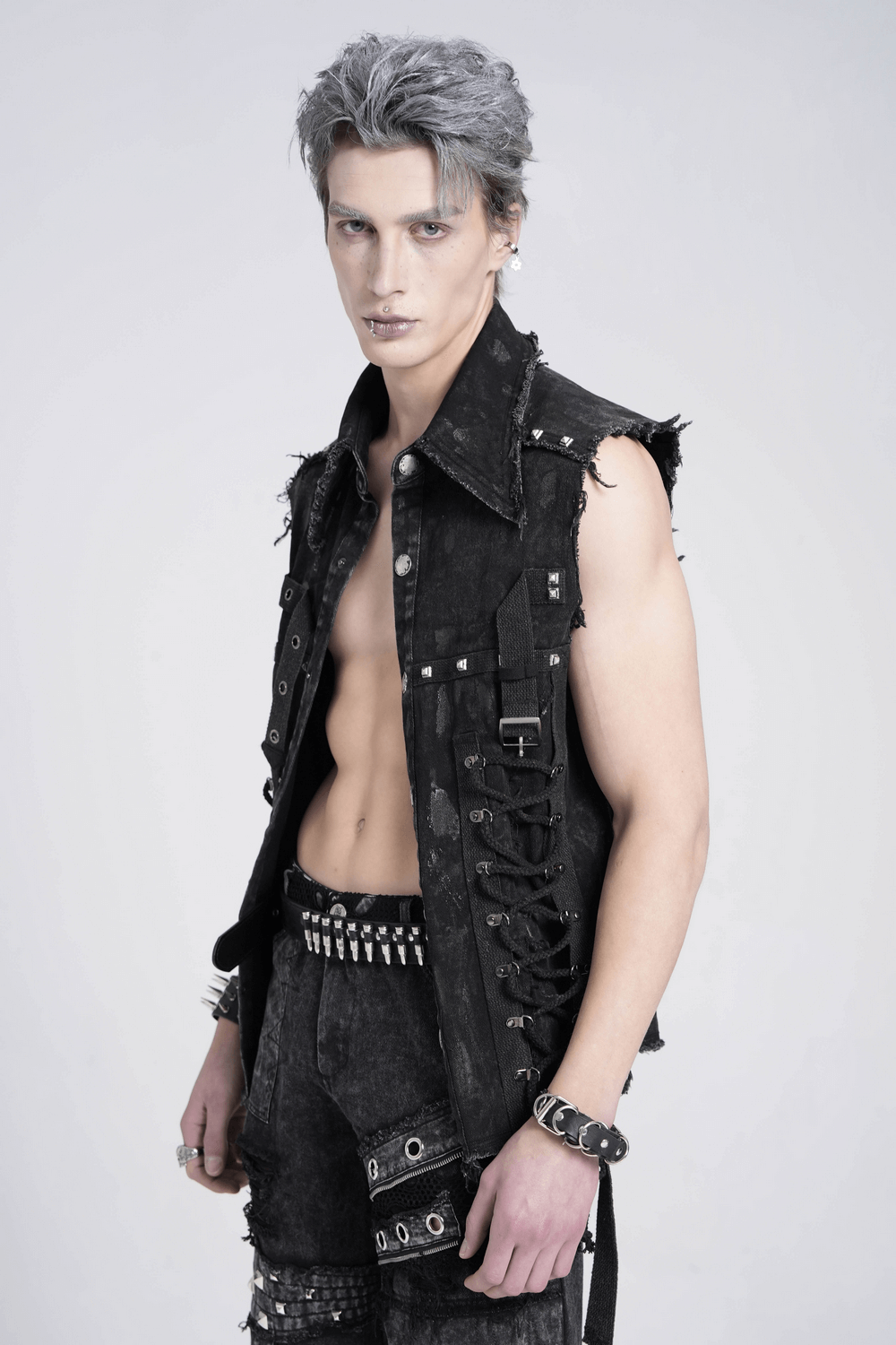 Punk denim shirt showcasing lace-up sides and studded details, perfect for a bold, edgy fashion statement.