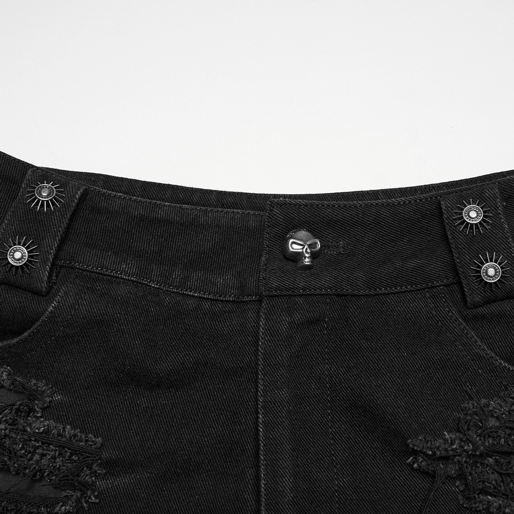 Detail of punk denim shorts with detachable bag and leg strap, featuring mixed metal hardware and edgy design.