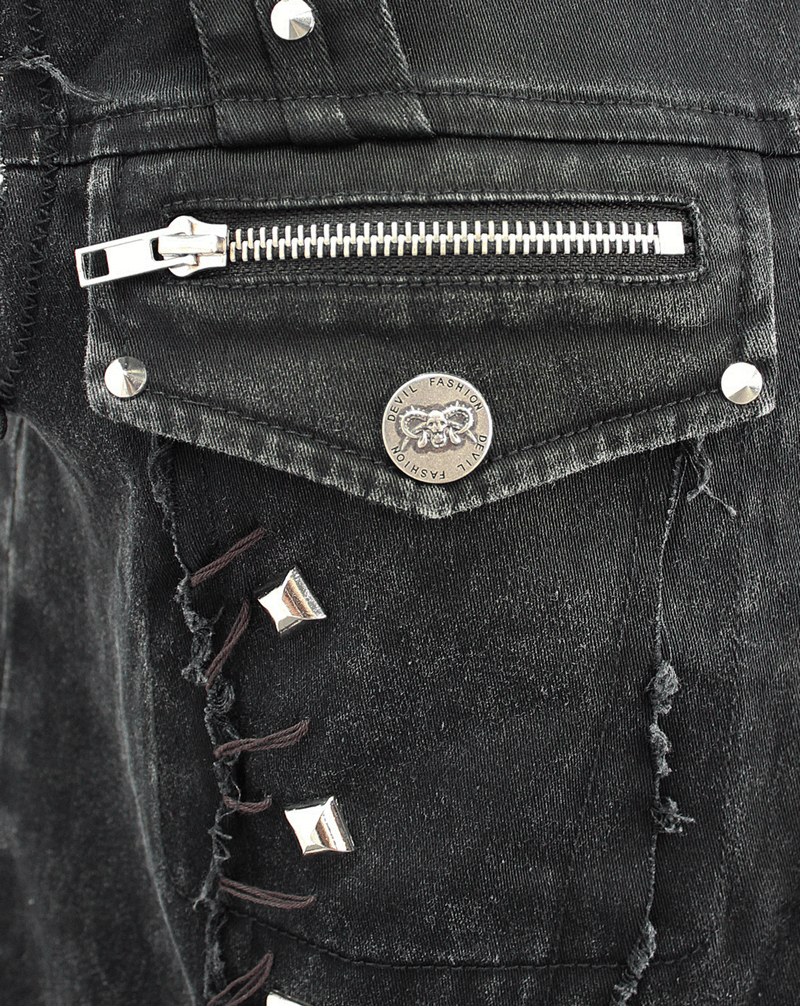 Close-up of the punk denim vest showing silver zipper pocket and stylish rivets on distressed black fabric.