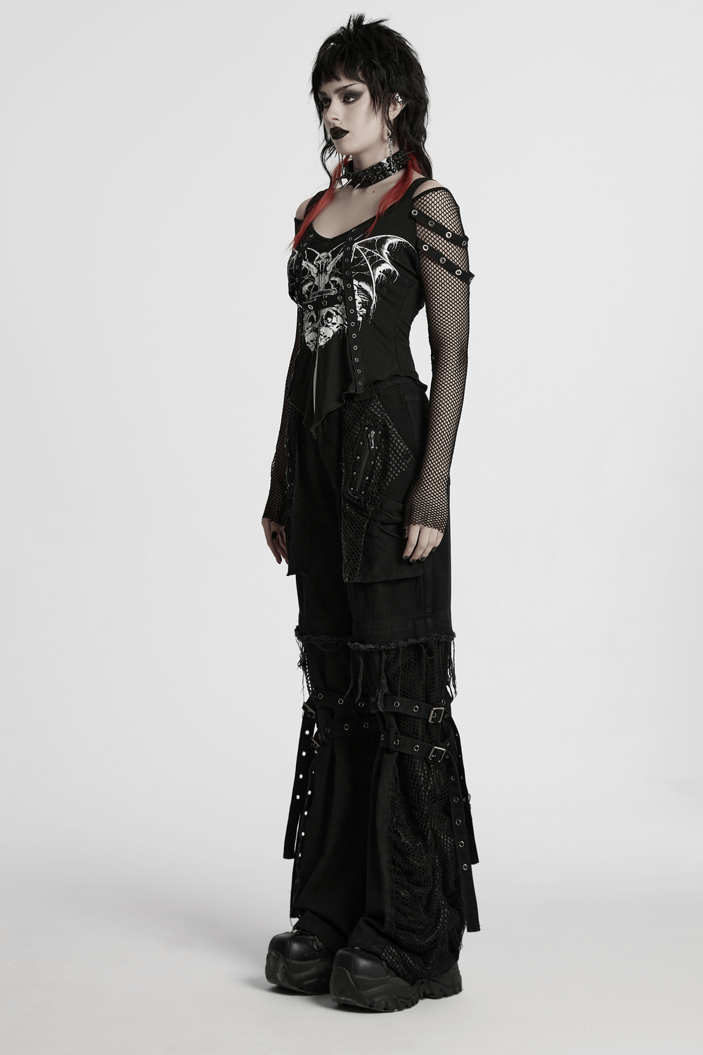 Side view of a model in punk detachable pants with mesh and studs, showcasing a bold, edgy style.