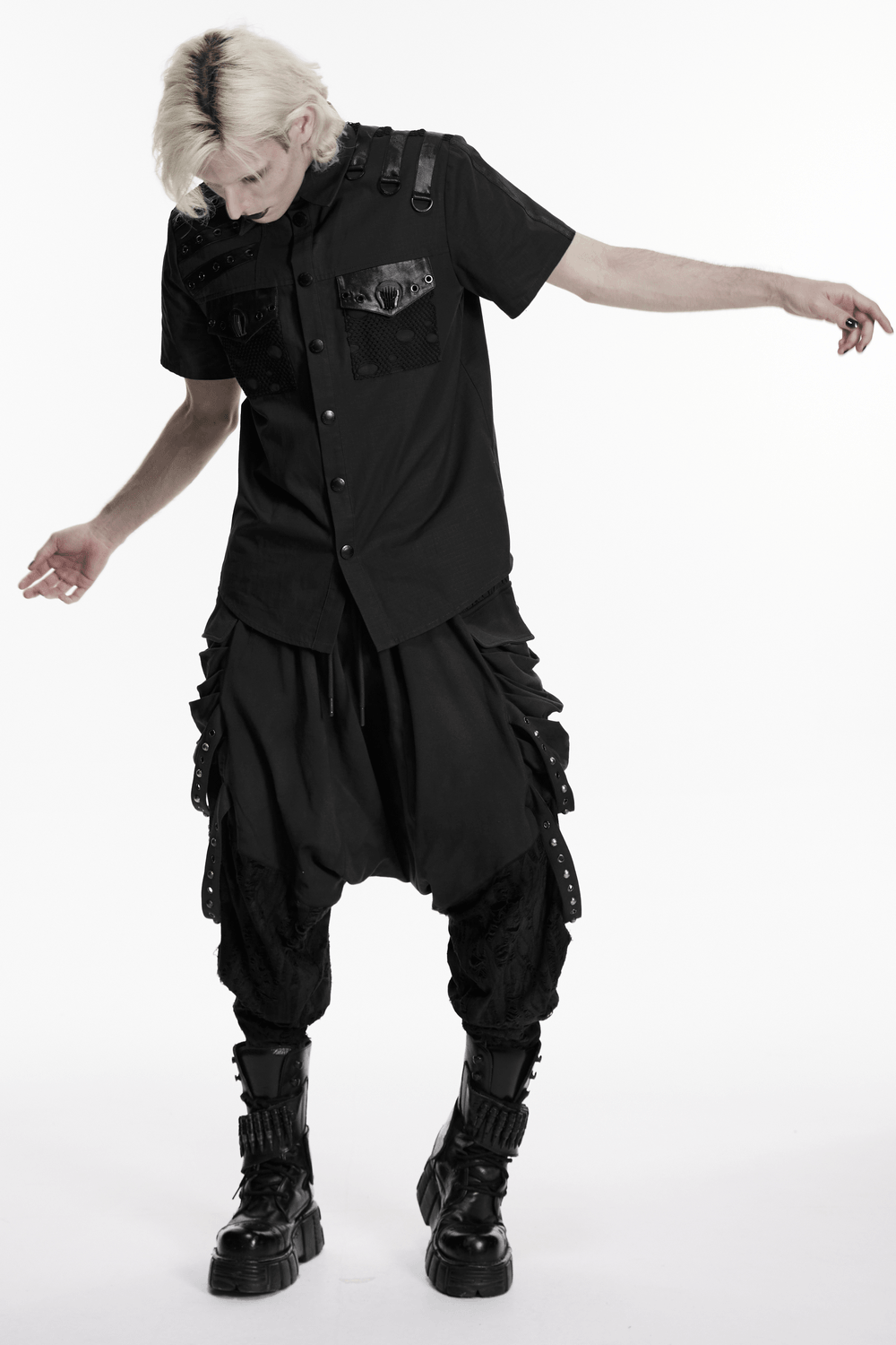Model wearing a Punk Distressed Shirt with D-Ring Shoulder Loops, styled with dark baggy pants and boots.