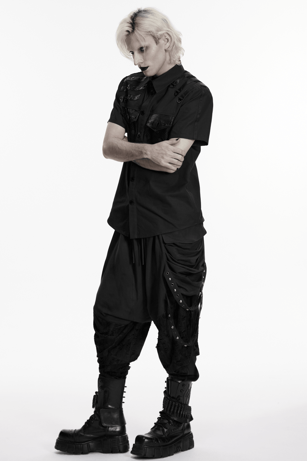 Punk Distressed Shirt with D-Ring Shoulder Loops worn with black baggy pants and chunky boots, showcasing a bold punk style.