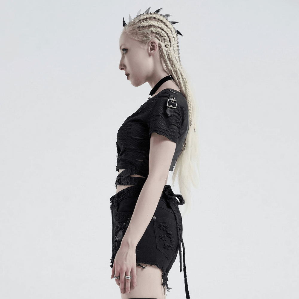 Edgy punk woman in black crop top and shorts, featuring braided hair and a unique gothic look.