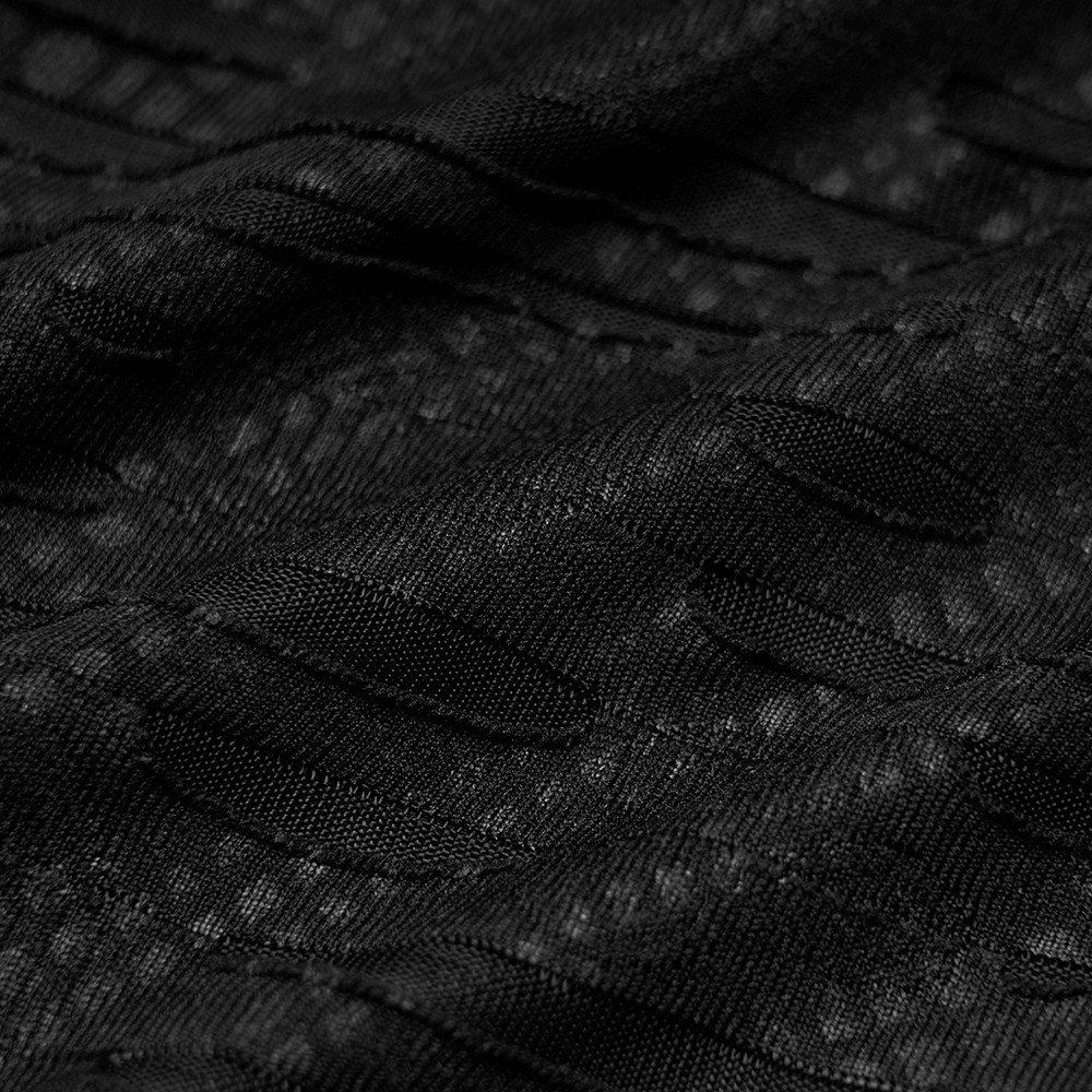Close-up of textured black fabric with ripped details, showcasing the edgy style of a punk V-neck t-shirt.