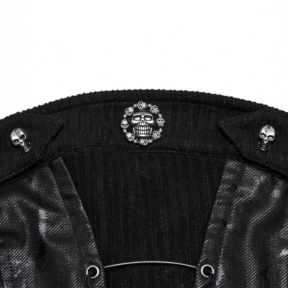 Close-up of black tube top featuring skull accents and metal hardware for a punk gothic style.