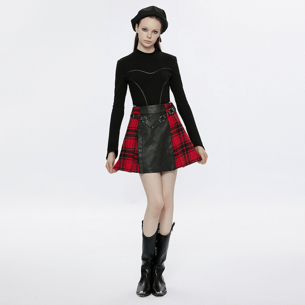 Punk plaid splice mini skirt featuring faux leather and rivet belt, paired with a stylish top and boots.