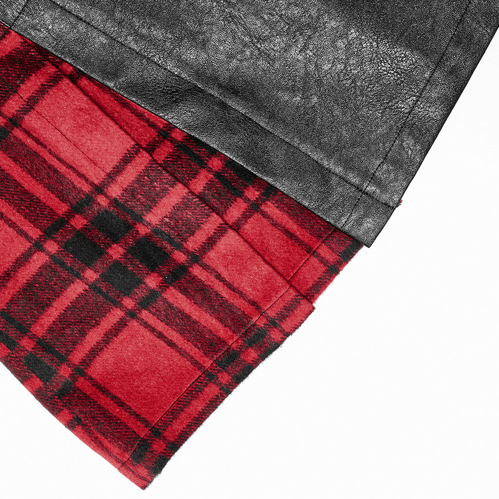 Close-up of punk faux leather and plaid splice mini skirt showcasing contrasting textures and bold colors.