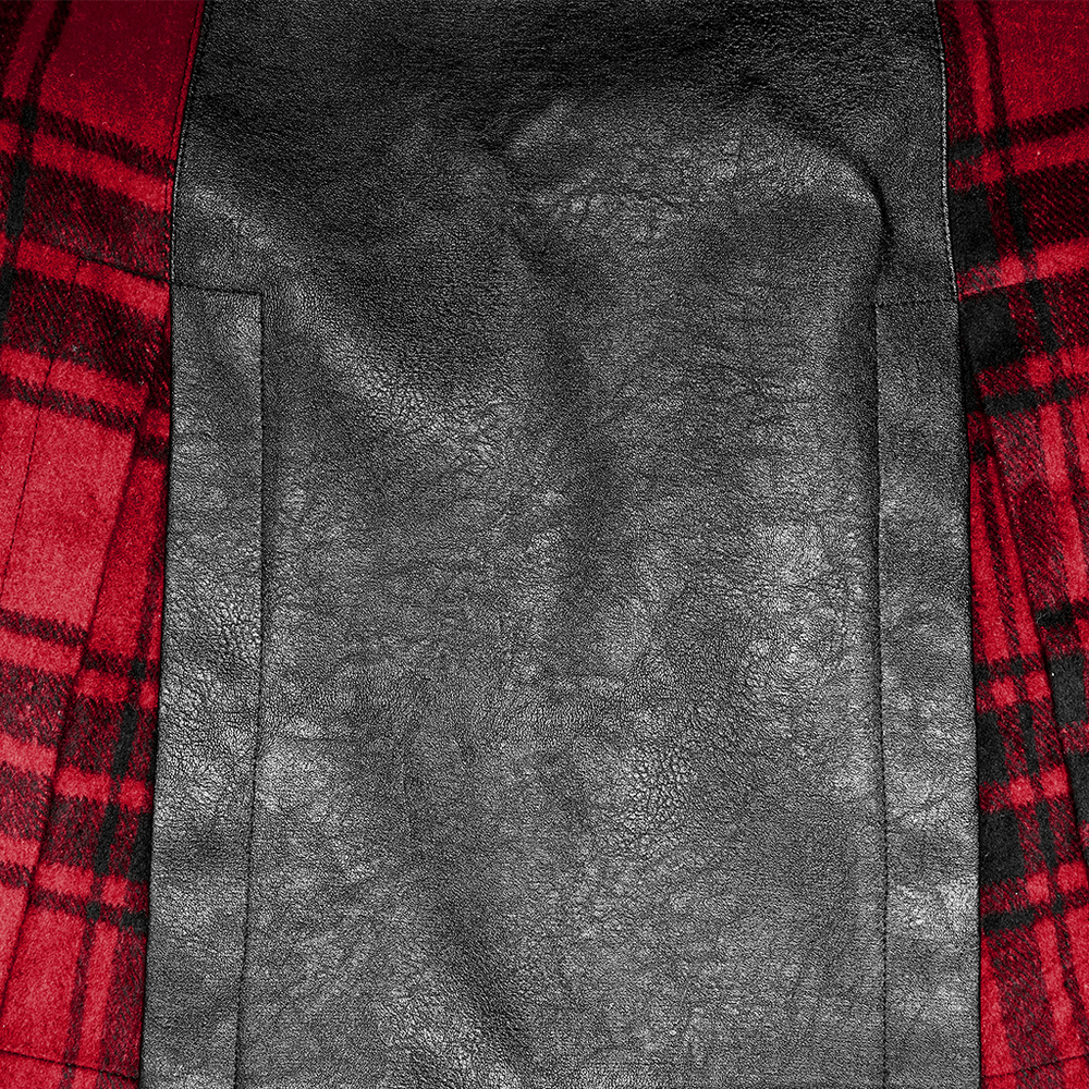 Close-up of punk faux leather and plaid splice fabric, showing edgy texture and details in red and black.
