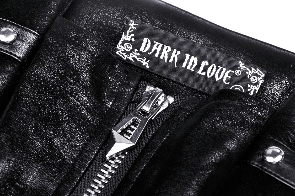 Close-up of black faux leather dress zipper and the 'Dark In Love' label, showcasing edgy style and quality details.