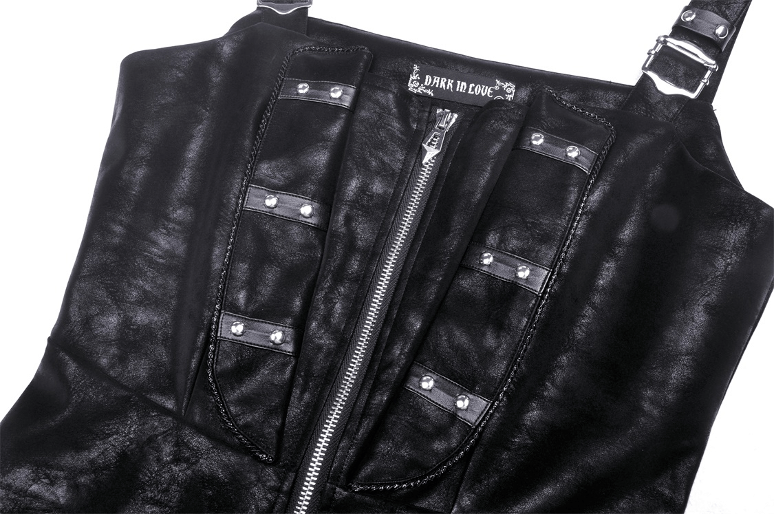 Close-up of a black faux leather mini dress featuring rivet and zipper accents, showcasing edgy strap details.