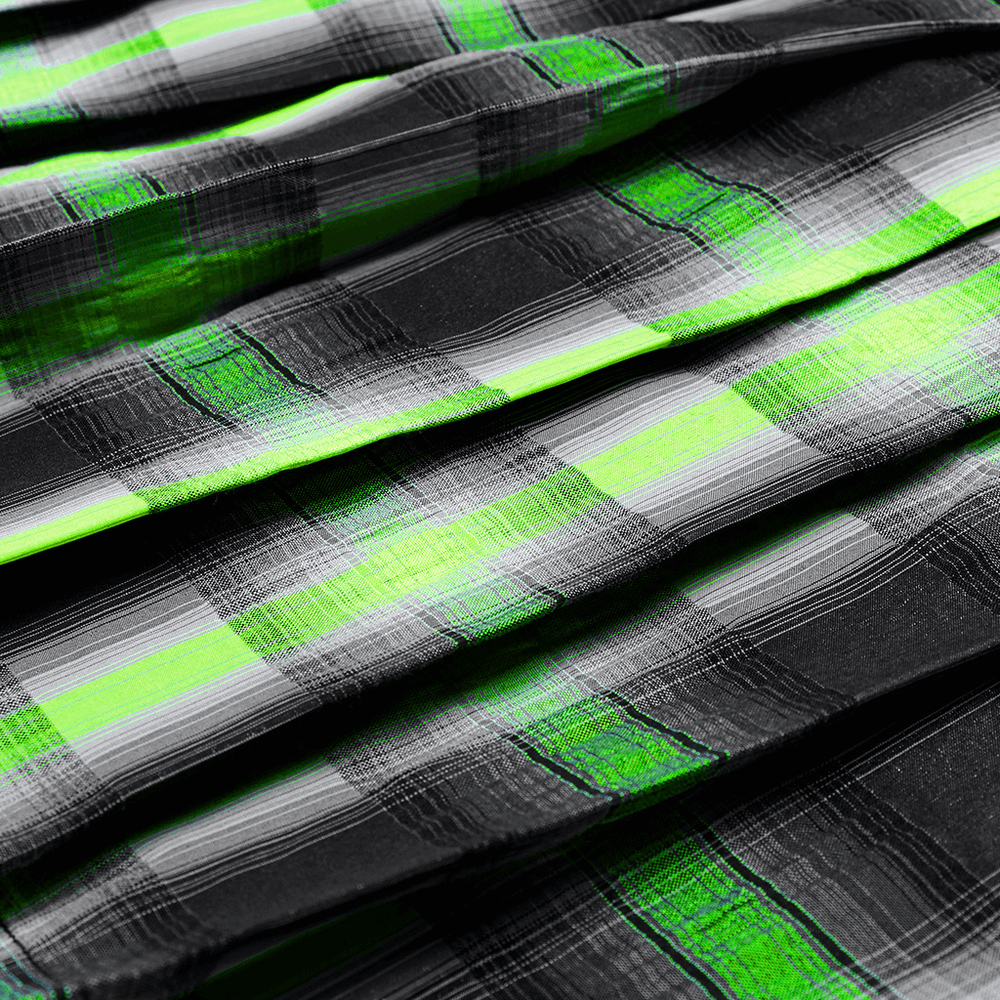 Close-up of punk female plaid fabric with bold green and black checkered pattern, showcasing modern edgy style.