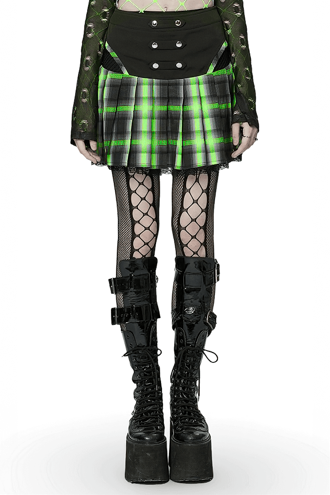 Punk female wearing a plaid skirt with lace, snap buttons, and fishnet tights, showcasing bold punk style.