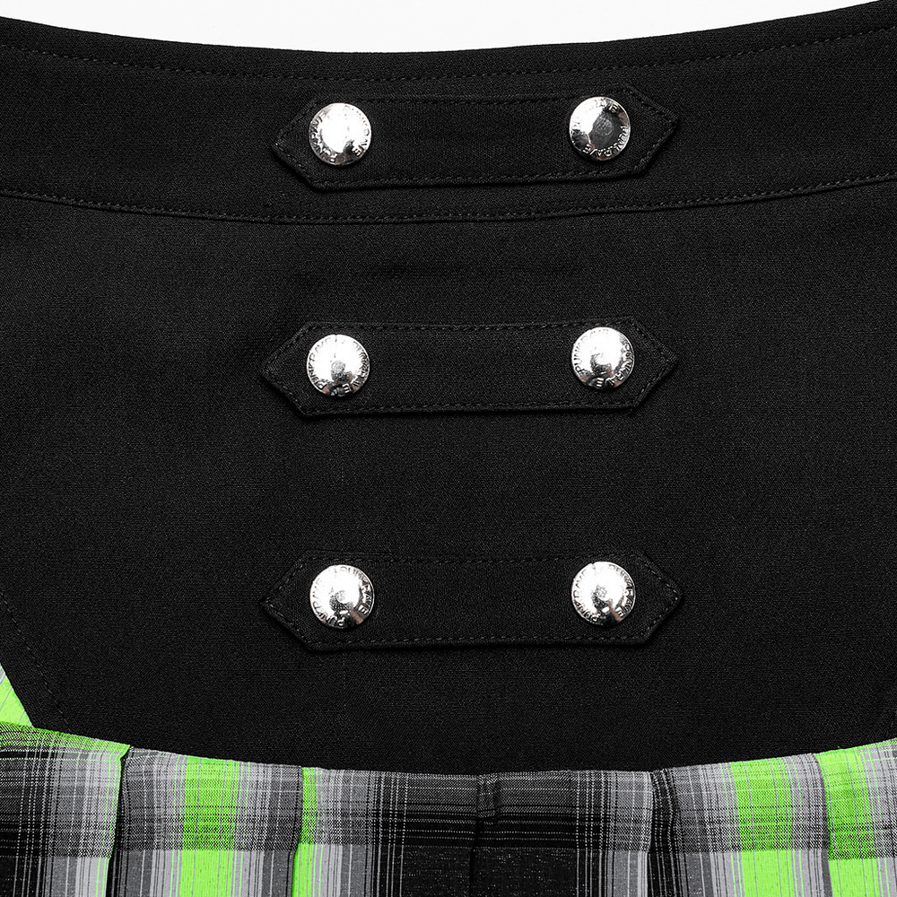 Close-up of decorative snap buttons on a punk plaid skirt with hollow sides and edgy design.
