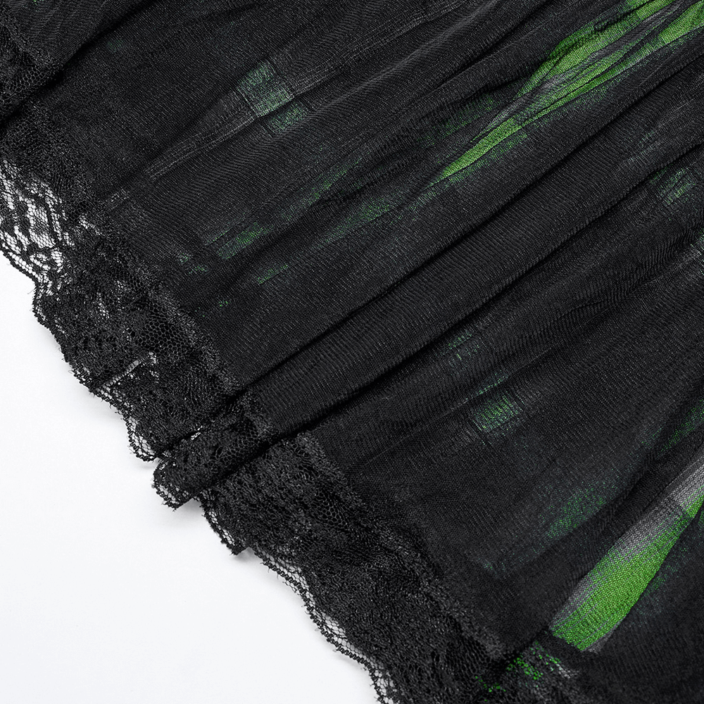 Close-up of a black punk skirt, featuring lace trim and green accents, showcasing its edgy, stylish design.