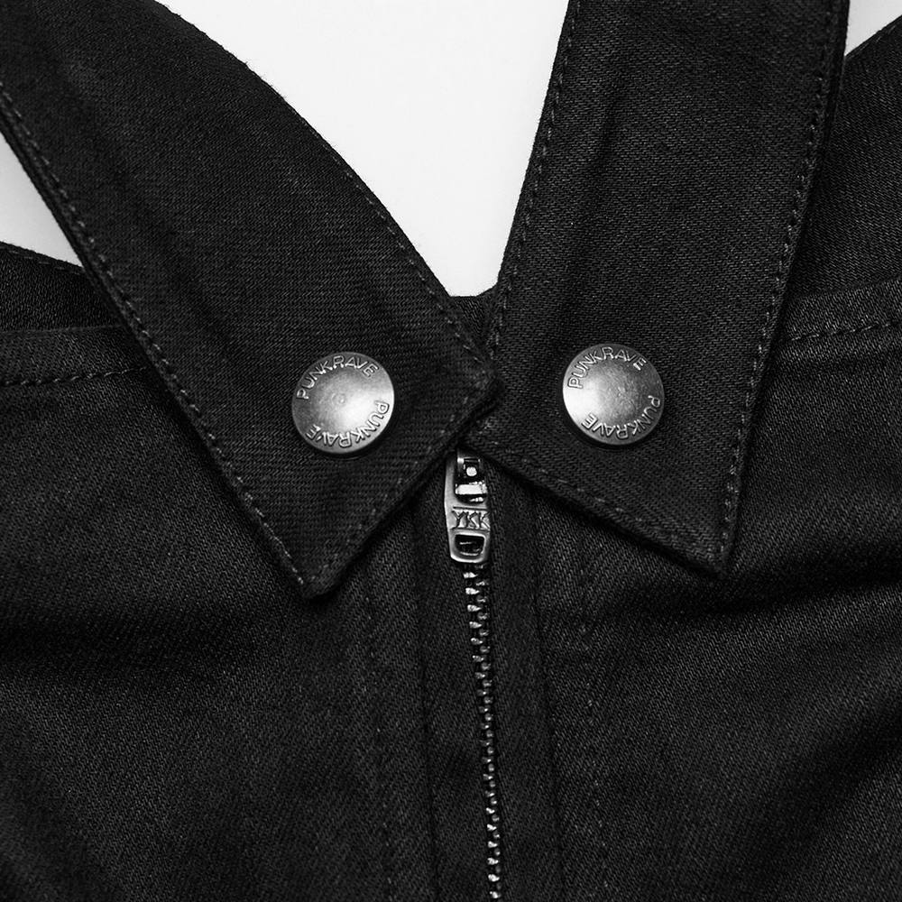 Close-up of black punk riveted shorts with zipper and metallic button details for edgy fashion.