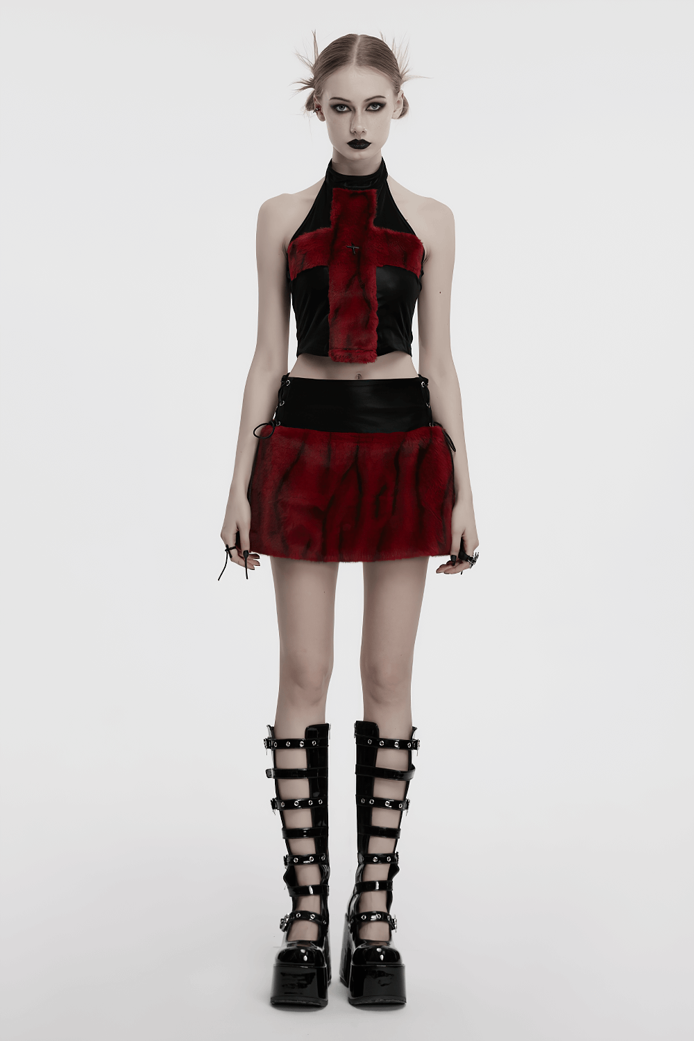 Punk flame tie-dyed faux leather and fur skirt paired with a matching top and knee-high lace-up boots.