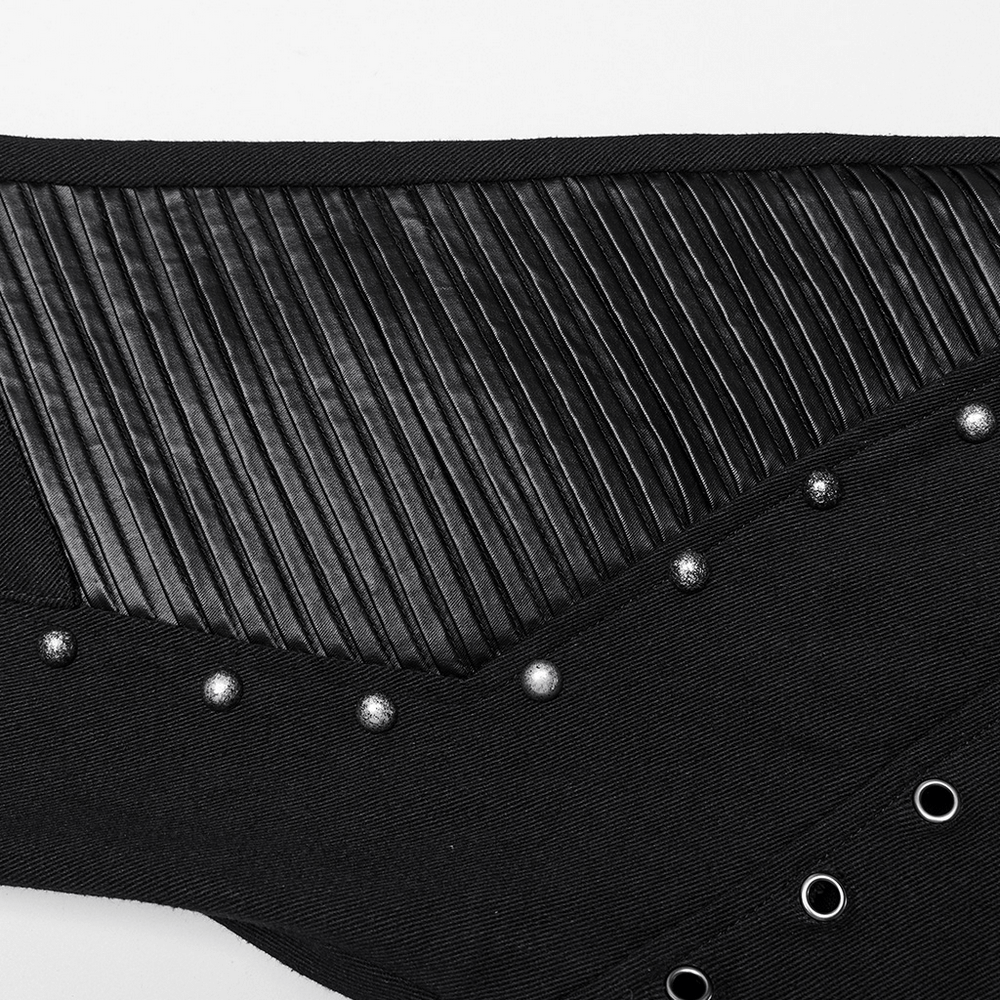 Close-up of black punk flare trousers featuring ribbed leather panels and silver rivets for an edgy, stylish look.