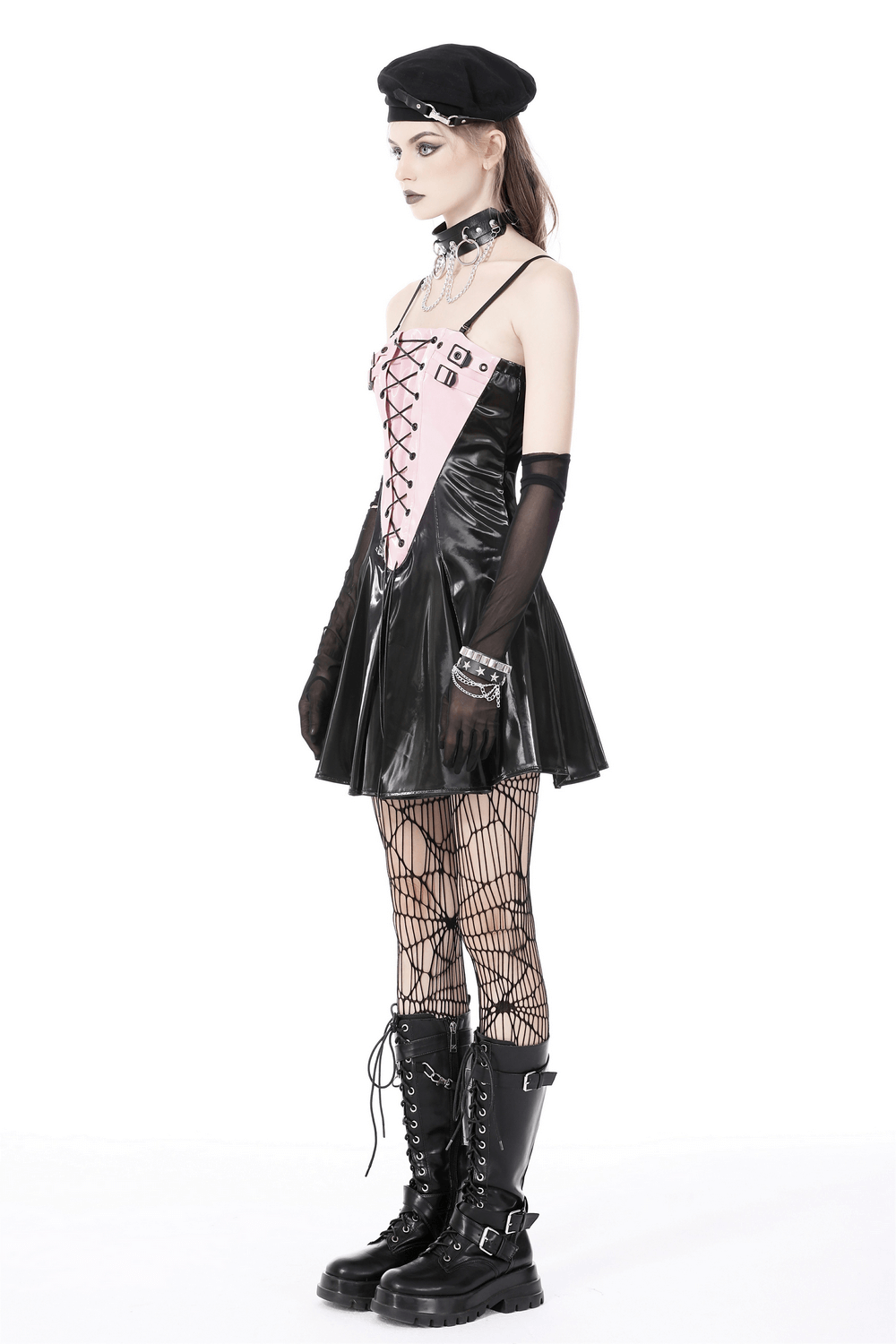 Punk Glossy Vinyl Lace-Up Mini Dress featuring black patent leather and soft pink accents, styled with fishnets and bold boots.