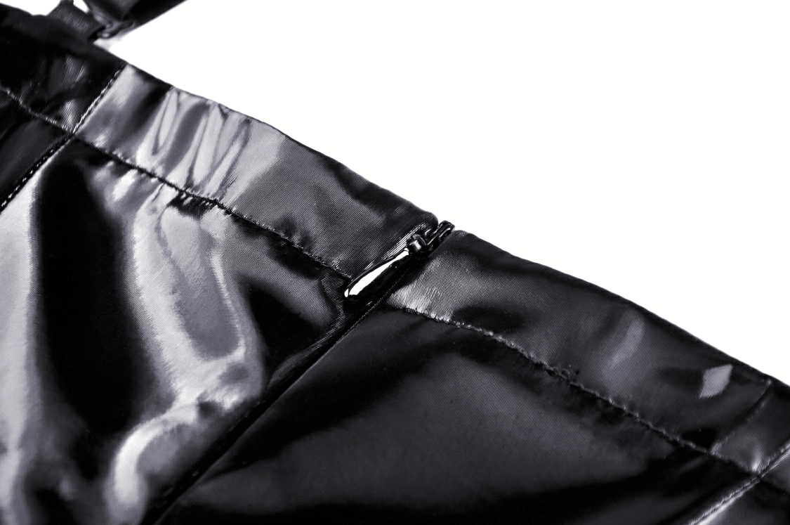 Close-up of the shiny black patent leather detailing and zipper on a punk glossy vinyl dress.
