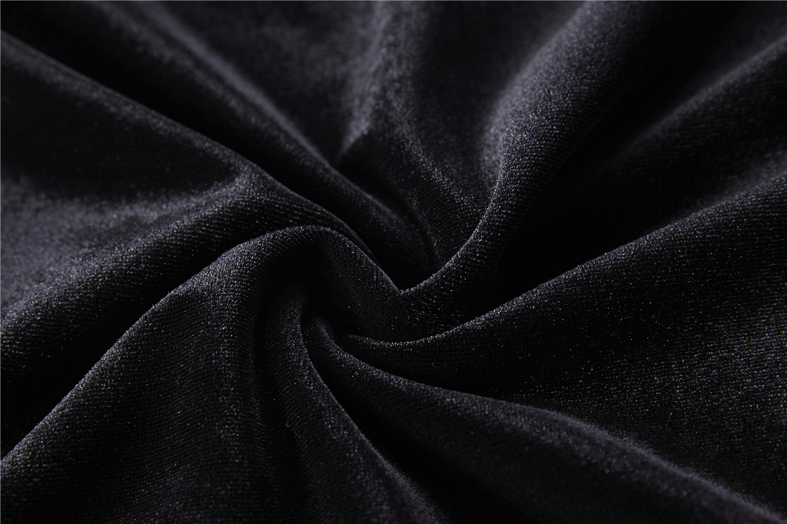 Close-up of luxurious black velvet fabric, perfect for a punk goth lace-up turtleneck.