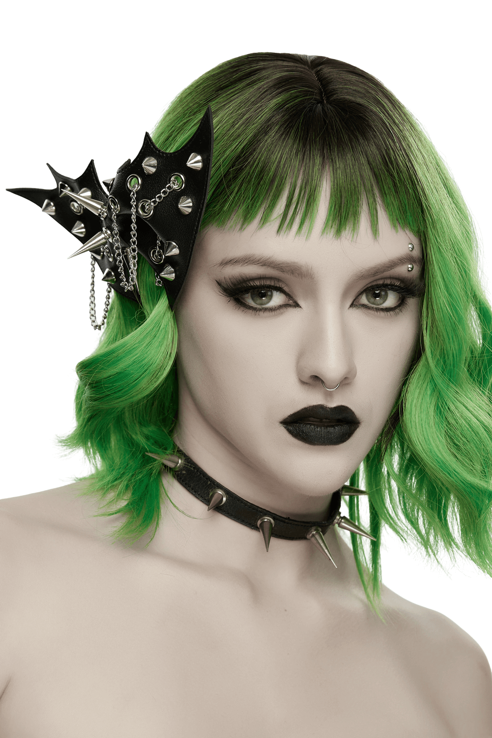 Punk Gothic Bat Wing Hair Clip with Spikes and Chains showcased in vibrant green hair with gothic makeup.