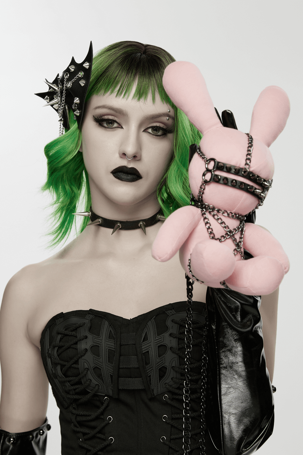 Punk Gothic Bat Wing Hair Clip with Spikes and Chains showcased by a model with vibrant green hair and edgy accessories.